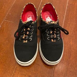 Black vans with leopard print trim
